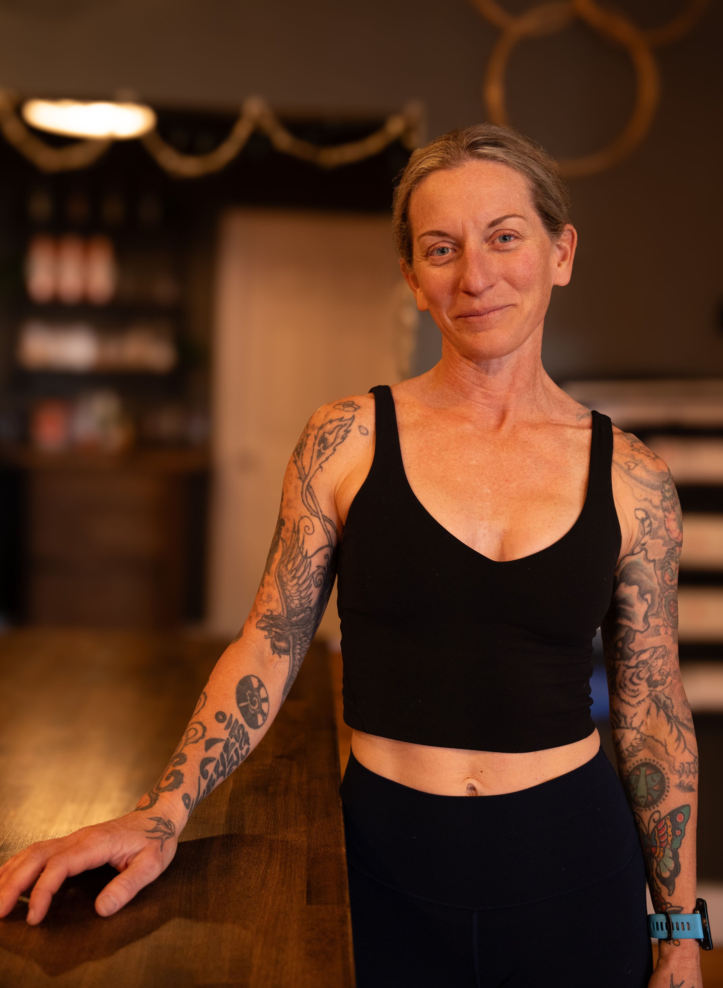 a colorful mural of a phoenix bird with wings spread wide, rising from fiery flames against a blue background
