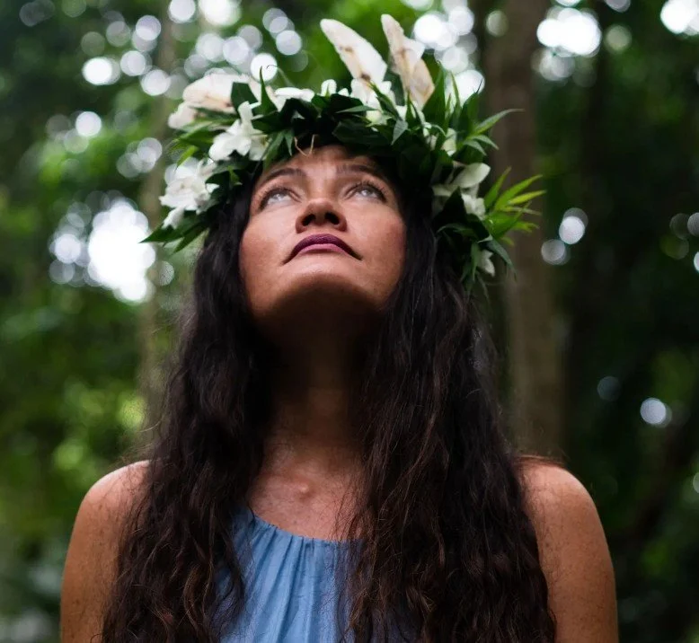 Keya Gai Guimaraes wearing a handcrafted lei crown. Her workshops at RISEilience in Amesbury celebrate Hawaiian culture, herbalism, and the art of lei making.