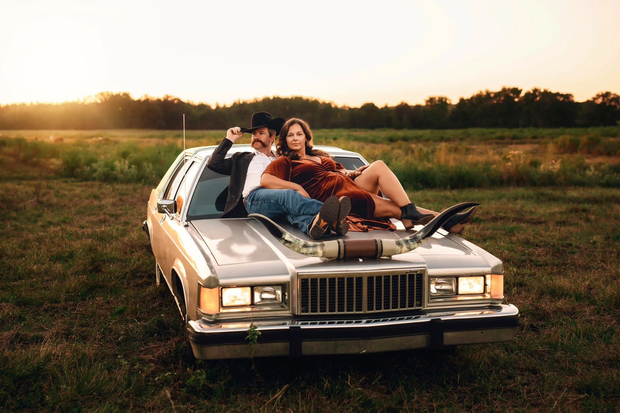 engagement photoshoot in a field arkansas.jpg