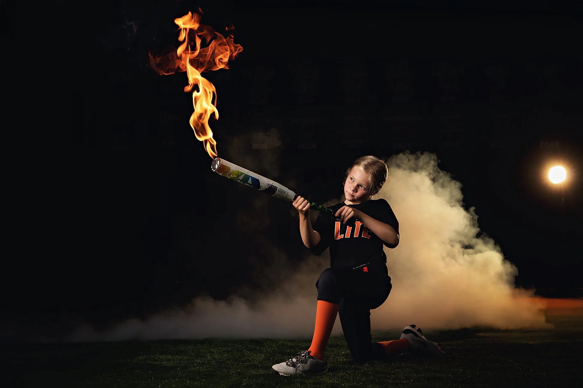 sports photography with fire arkansas.jpg