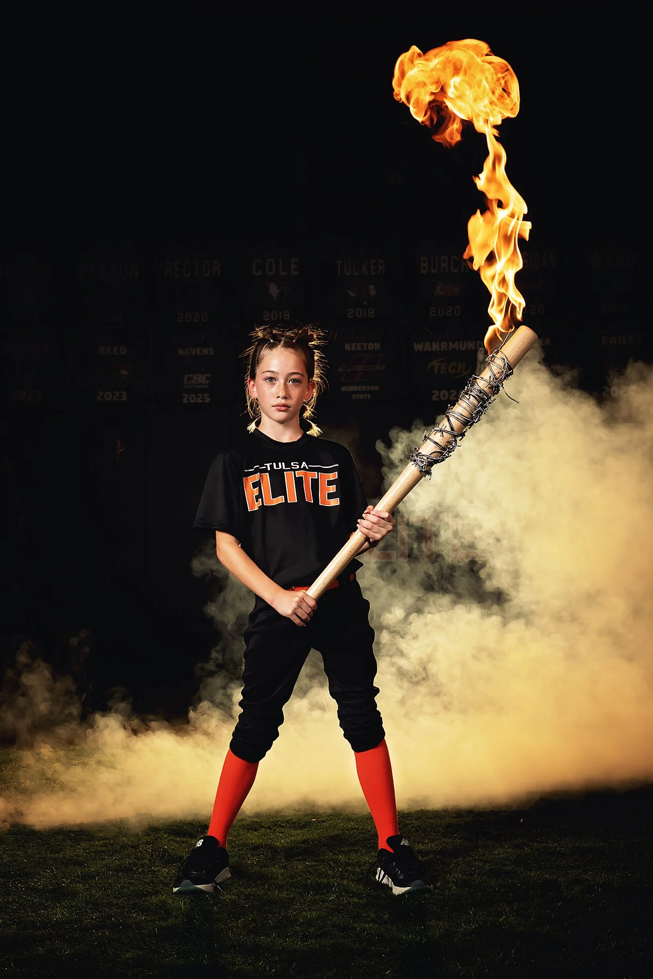 sports team photographers in arkansas with fire.jpg