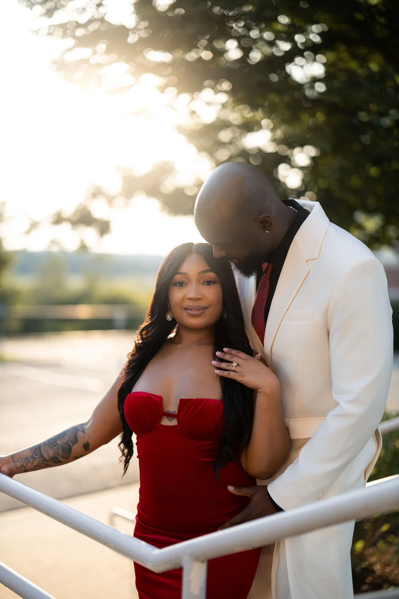 Engaged couple embracing outdoors at golden hour, Nashville couples photography by Kandid Keeno