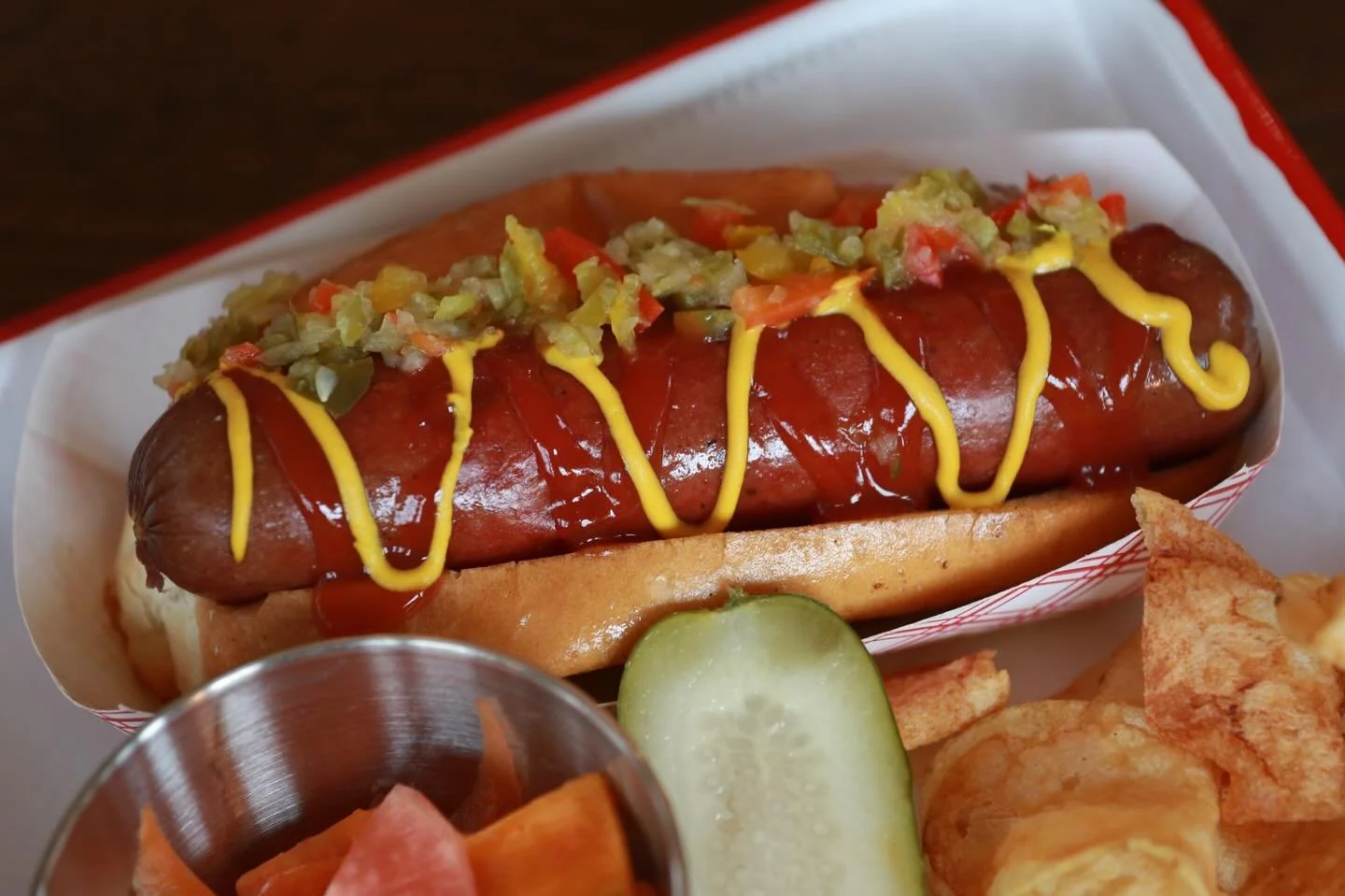 Open 7 days a week, 12pm to 8pm for a classic hot dog or a something a little more exciting like Elk or our Vegan Dog. All Maine made with a side of house made pickles! @lanternbar @happytrailsmaine @campdeforestme #hotdog #eatmaine #yummy #classic #