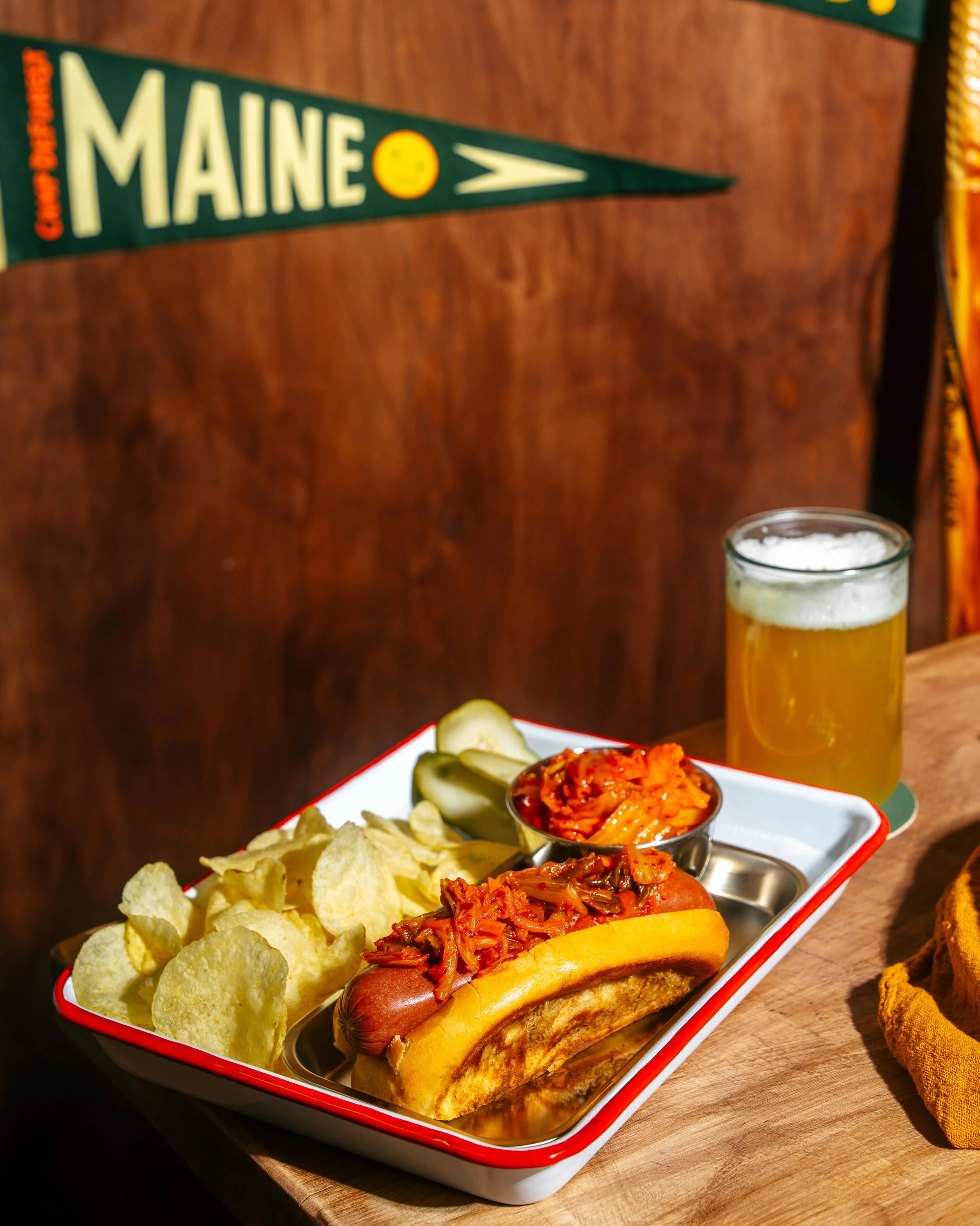 The weather is warm and the hot dogs are hot off the grill! 🌭 🔥 🍻 @campdeforestme @happytrailsmaine #hotdog #camp #maine #vacationland #yum Have you ever had a Kimchi Dog?!? Our Chef and Manager Ranger Ben makes our own at Happy Trails camp kitche
