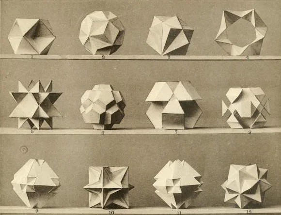 A sepia-toned image displaying various geometric origami shapes arranged in rows on three shelves.