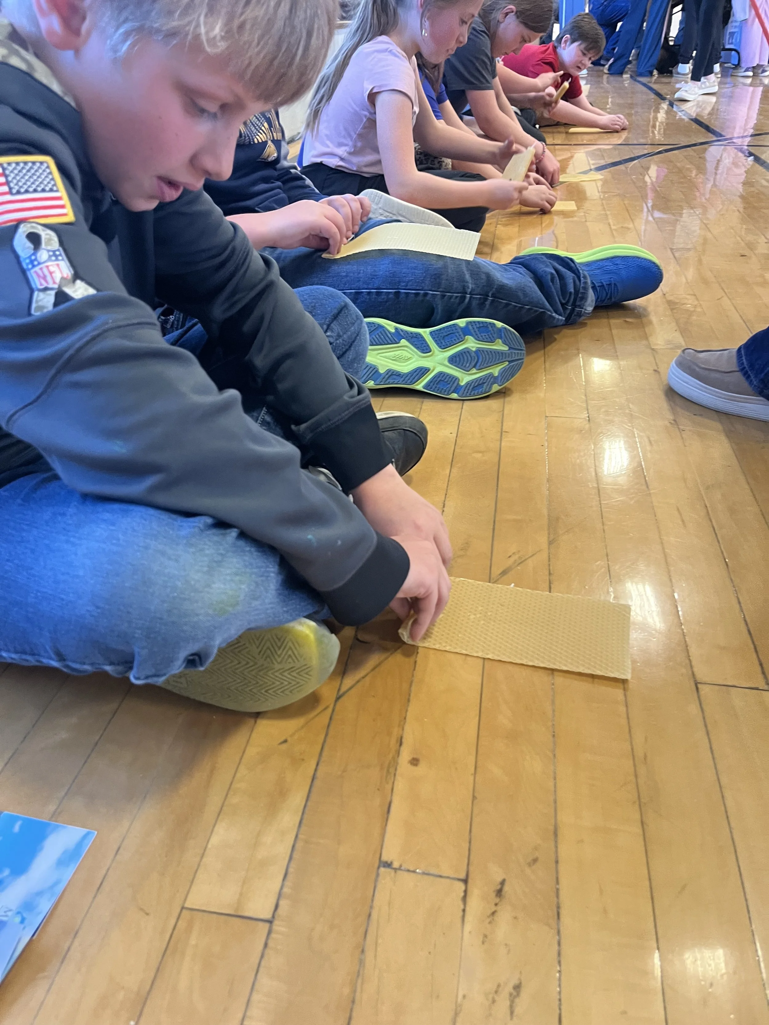2026 Conservation & Ag Kid's Day Event - A student learning how to make Beeswax candles from Grace McDonald of Montana Farmer's Union 