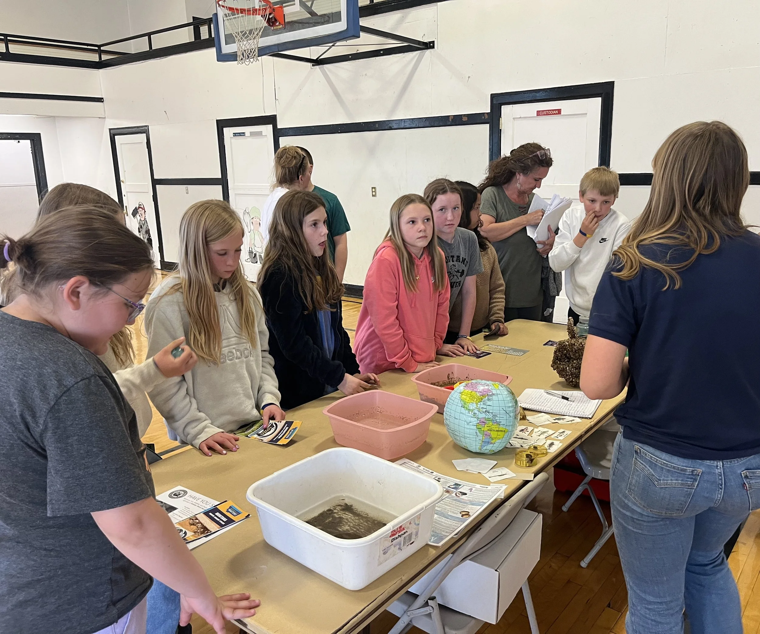 2026 Conservation & Kid's Ag Day Event - The sixth grade class learning from Rayna Ponessa of FWP in Aquatic Invasive Species 
