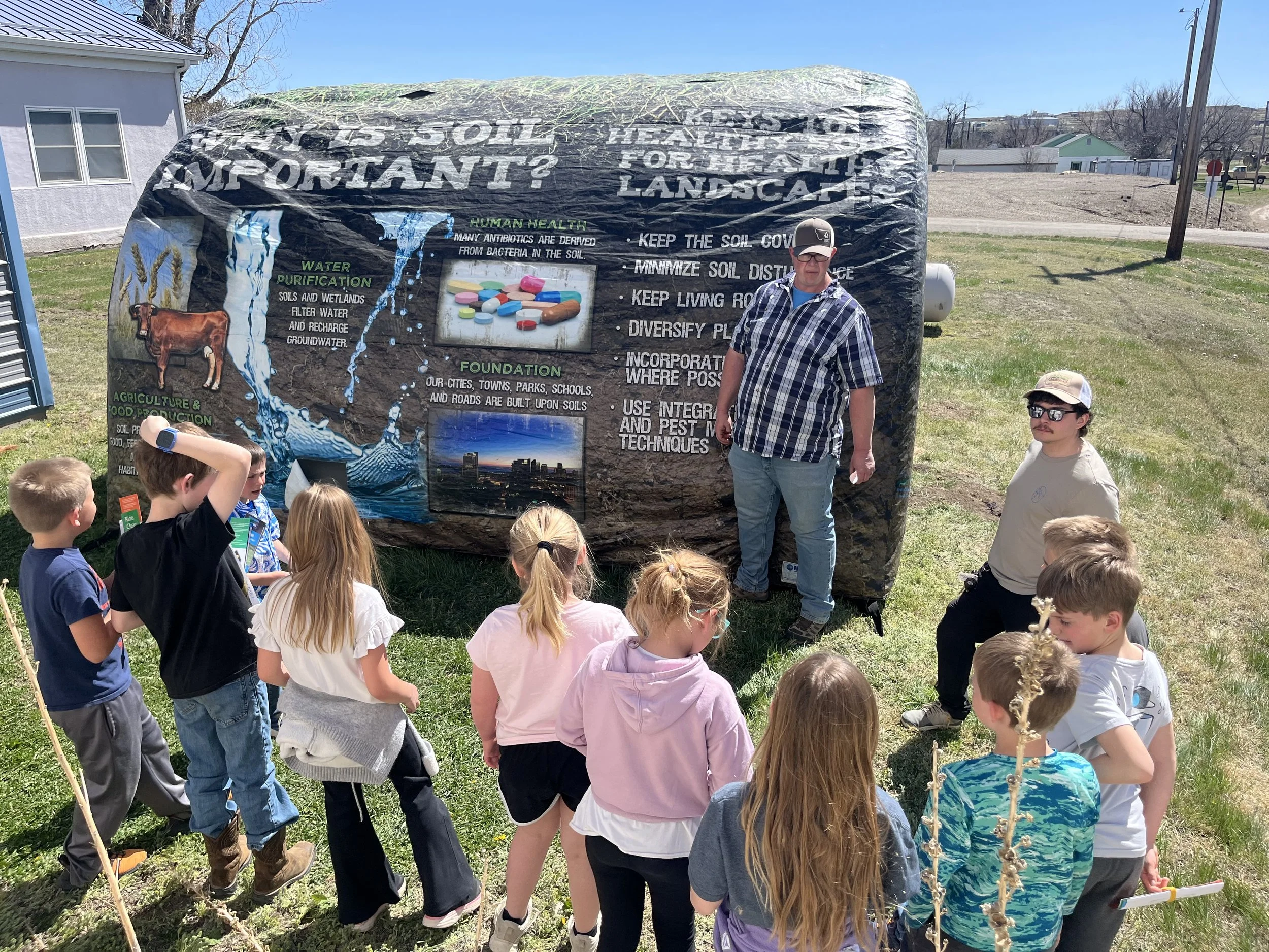 2026 Conservation & Ag Kid's Day Event - BG Fitzgerald of NRCS presenting to the kids on soil health with the soil health tunnel