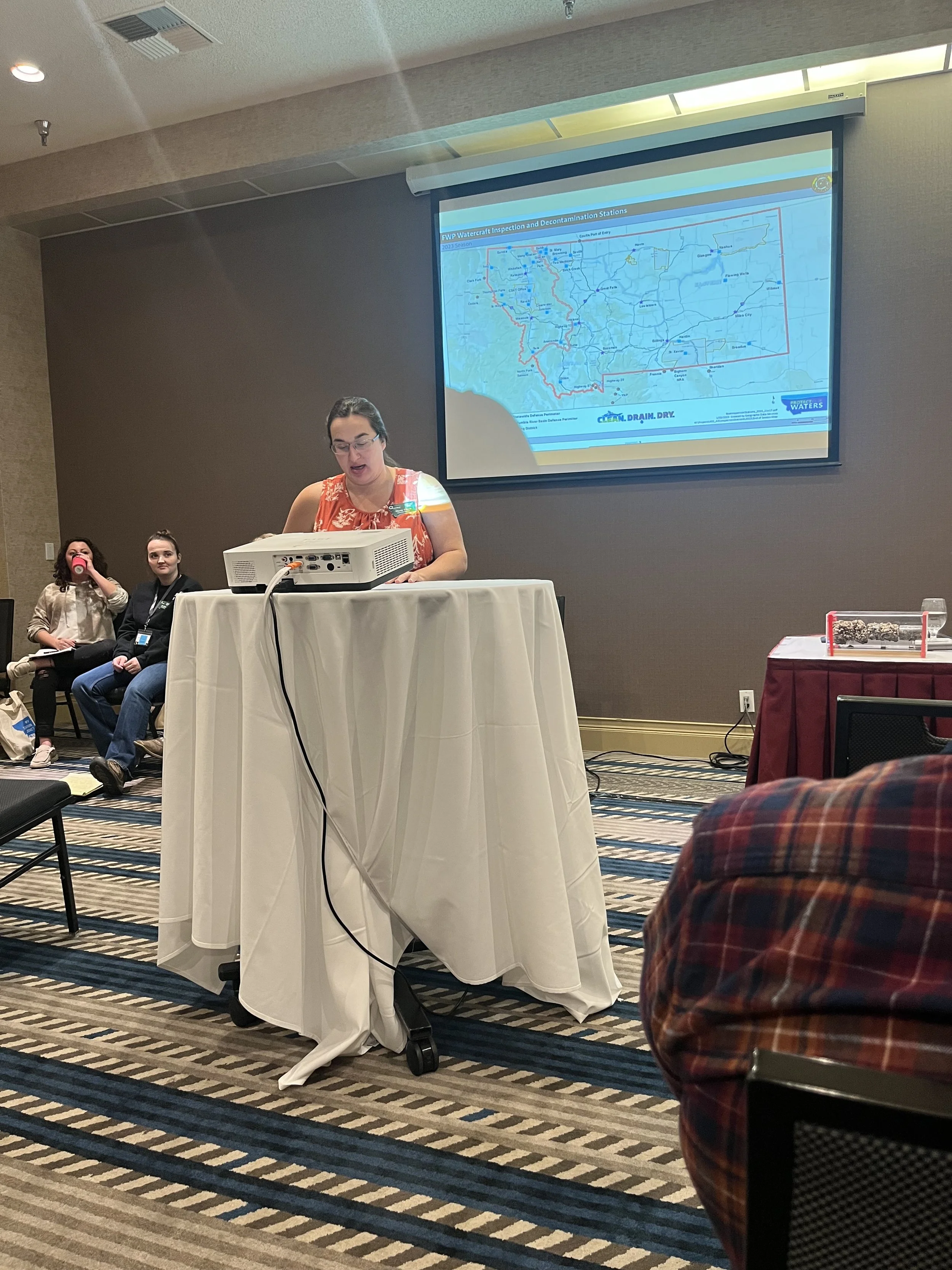 Dusty Olson, Past Administrator presenting at the 2023 MACD Convention on the AIS WIS Stations at Flowing Wells and Wibaux 