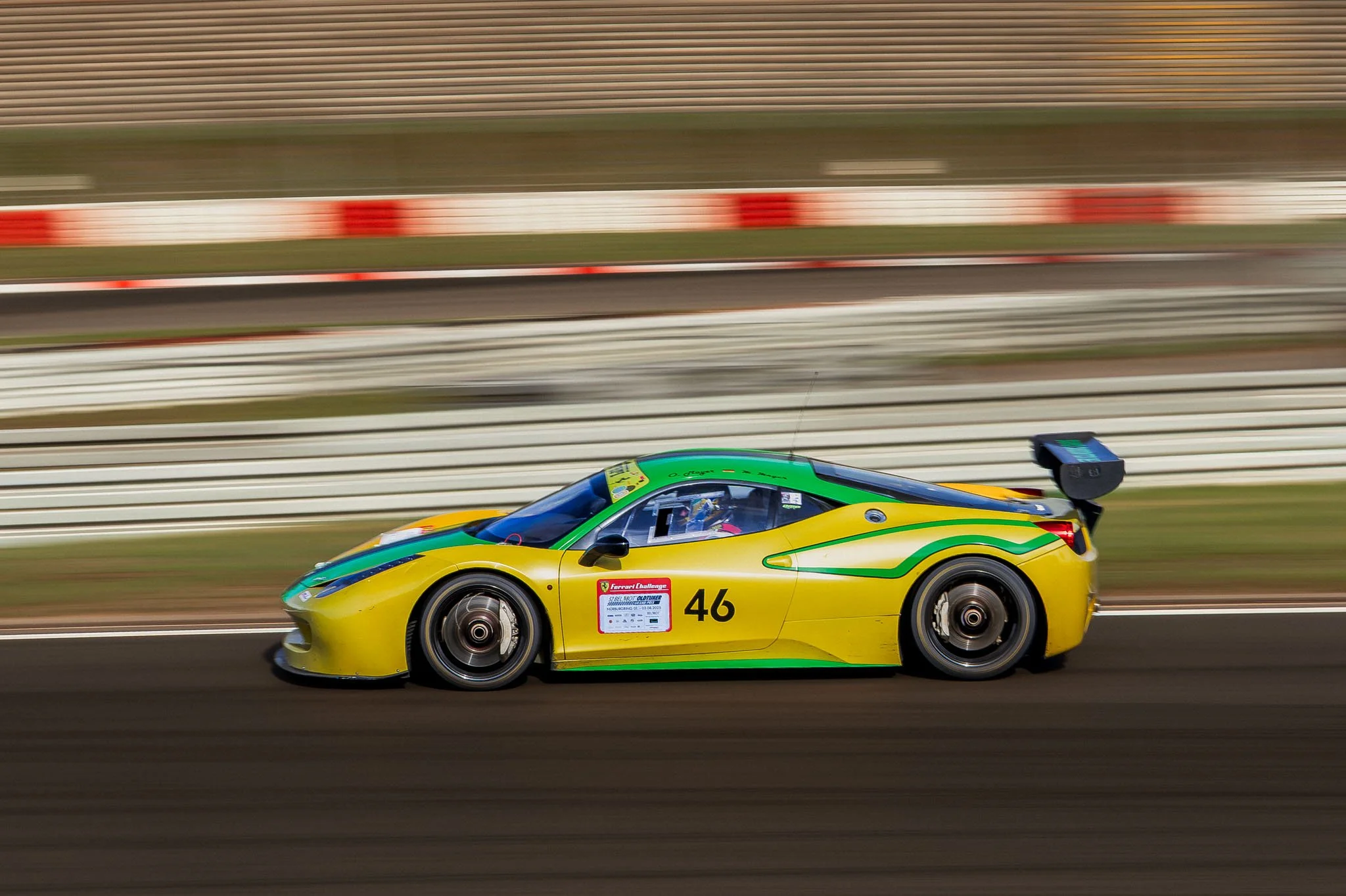 Ferrari Challenge race car #46 on track at Nürburgring captured with panning motion by RDRFotografie. 