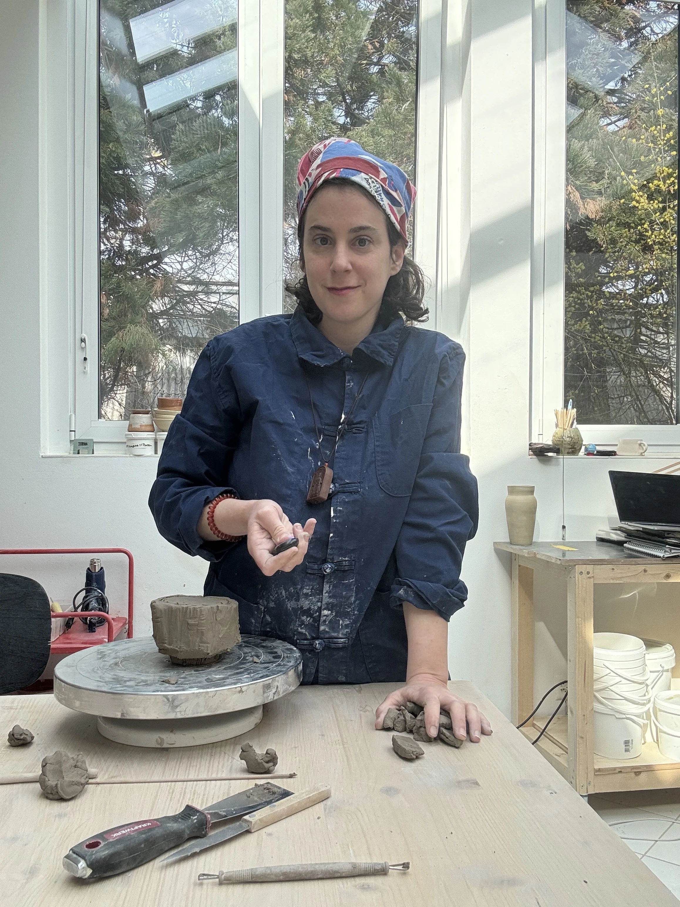 ceramic teacher working with clay in Zurich studio
