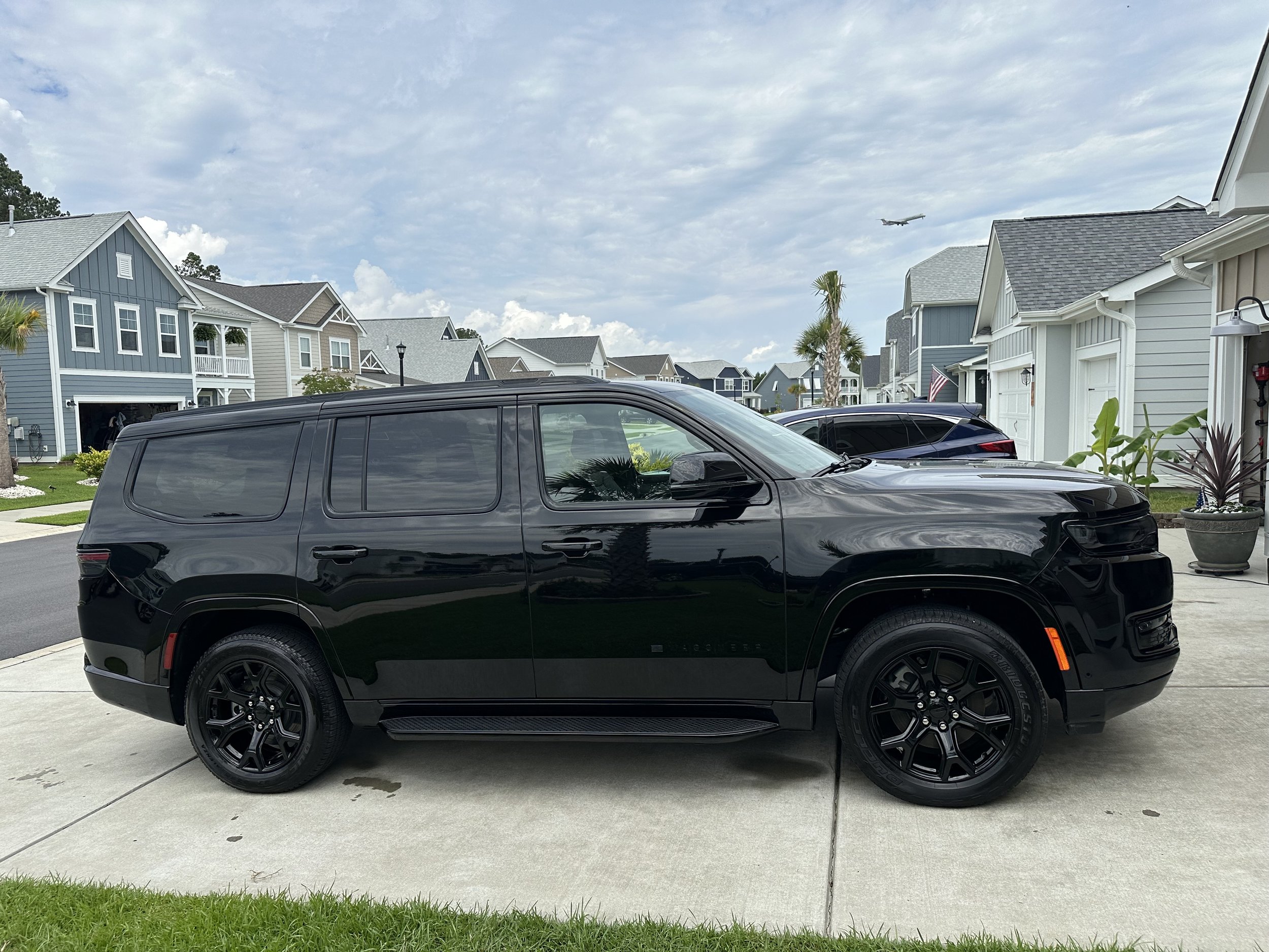 Black Jeep Wagoneer Side View.jpg