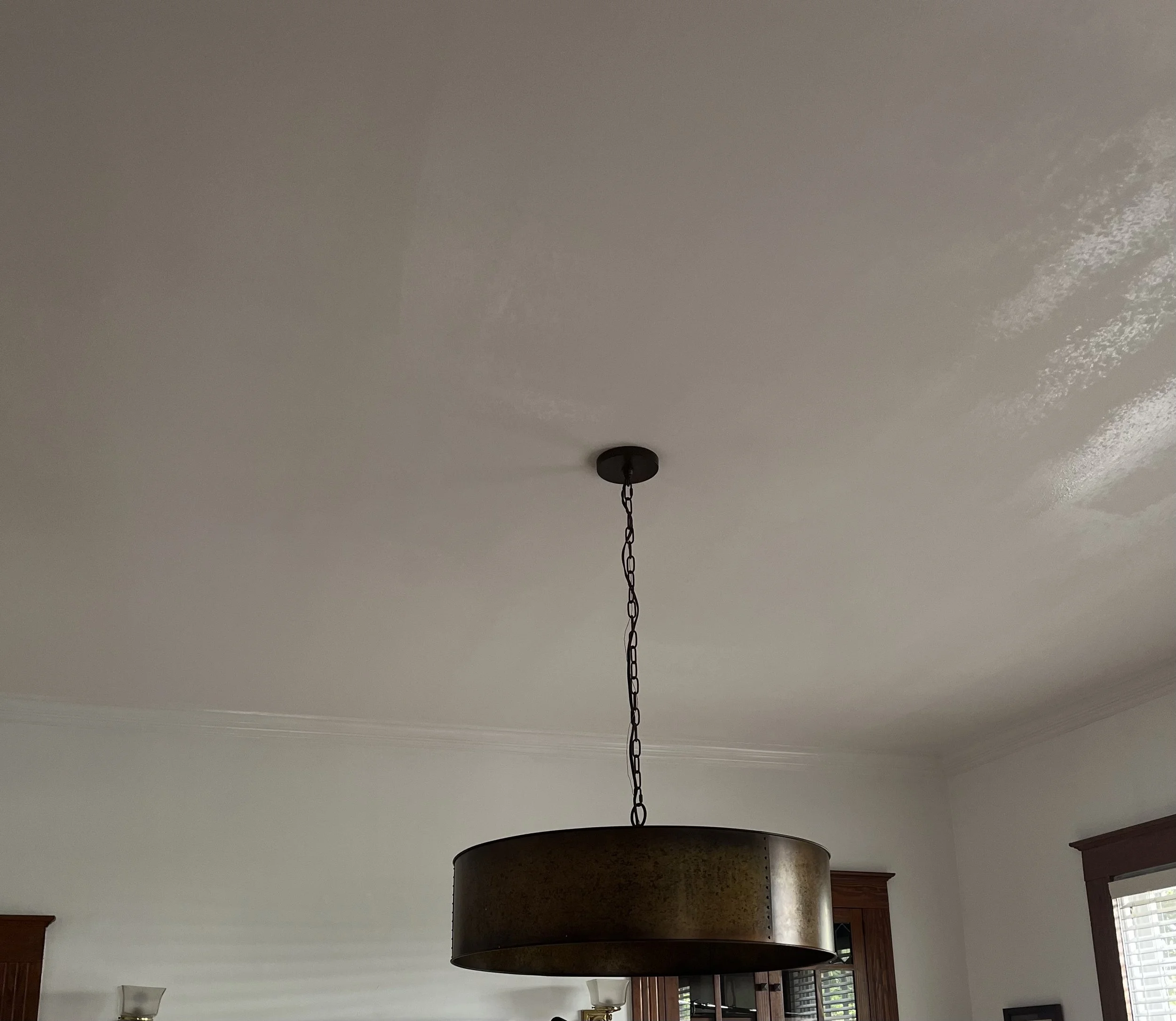 Pendant light fixture suspended from an interior ceiling.