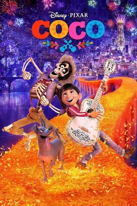 Animated characters from Disney Pixar's Coco, including a skeleton and a human boy playing guitar, with a dog, colorful fireworks, and a glowing orange pathway in a festive nighttime setting.