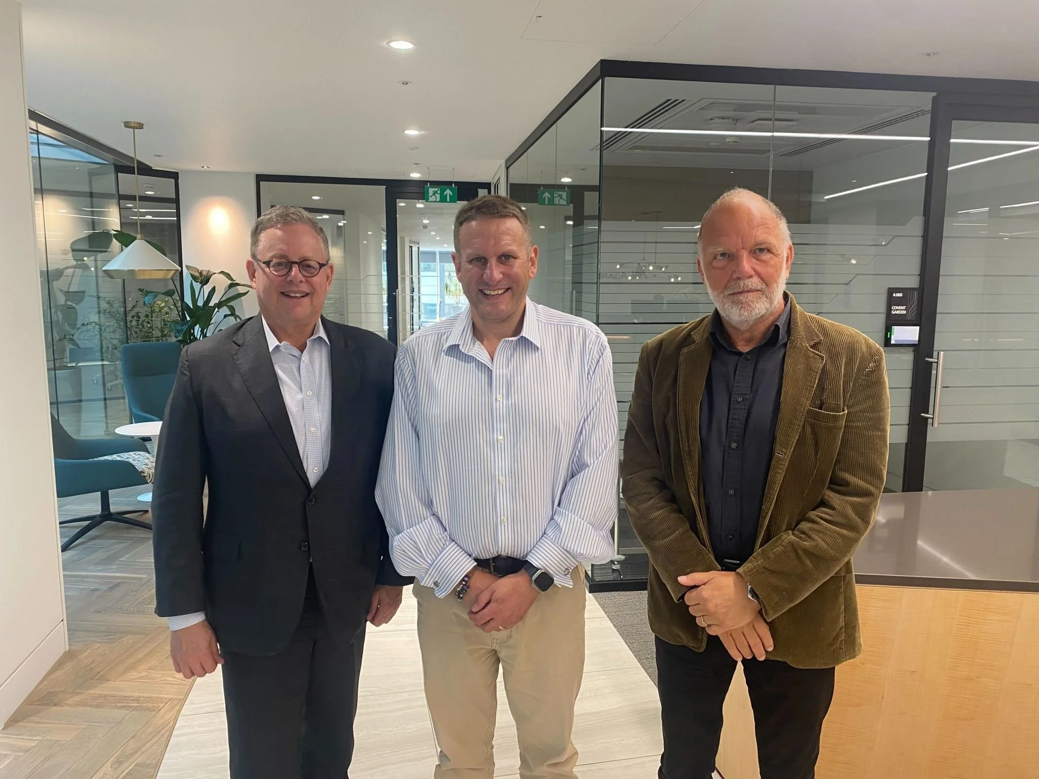 Jeff Korzenik of Fifth Third Bank, Phil Beckett of Alvarez & Marsal, and Paul Cowley of Iceland Foods pose for photo after UK Fair Chance Hiring Roundtable