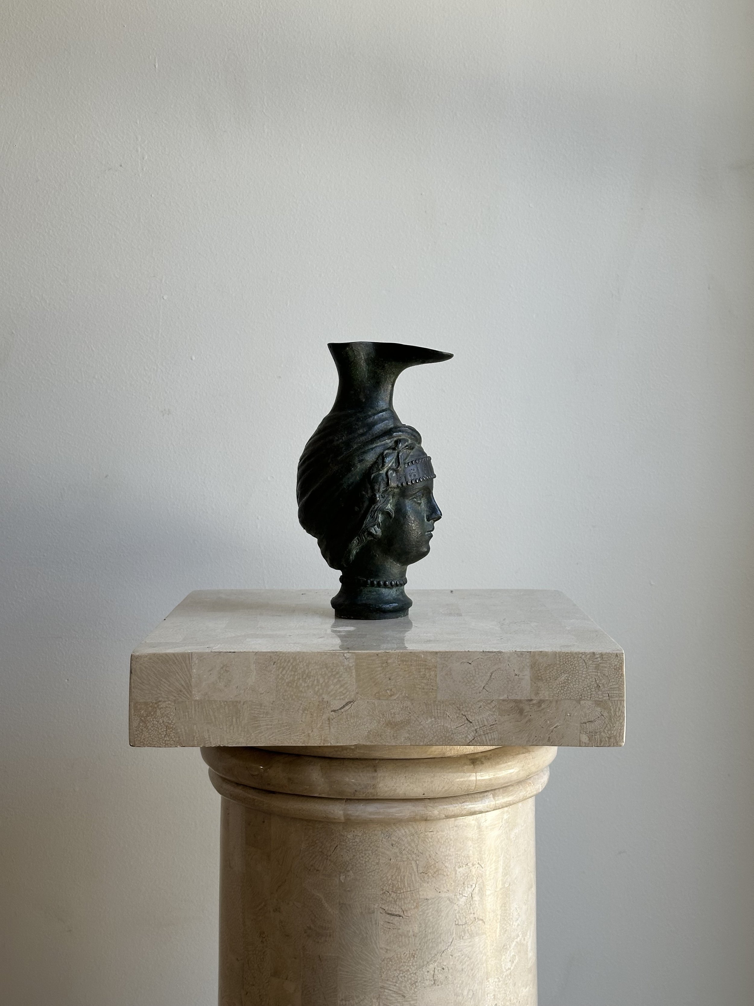 Bronze pitcher with face