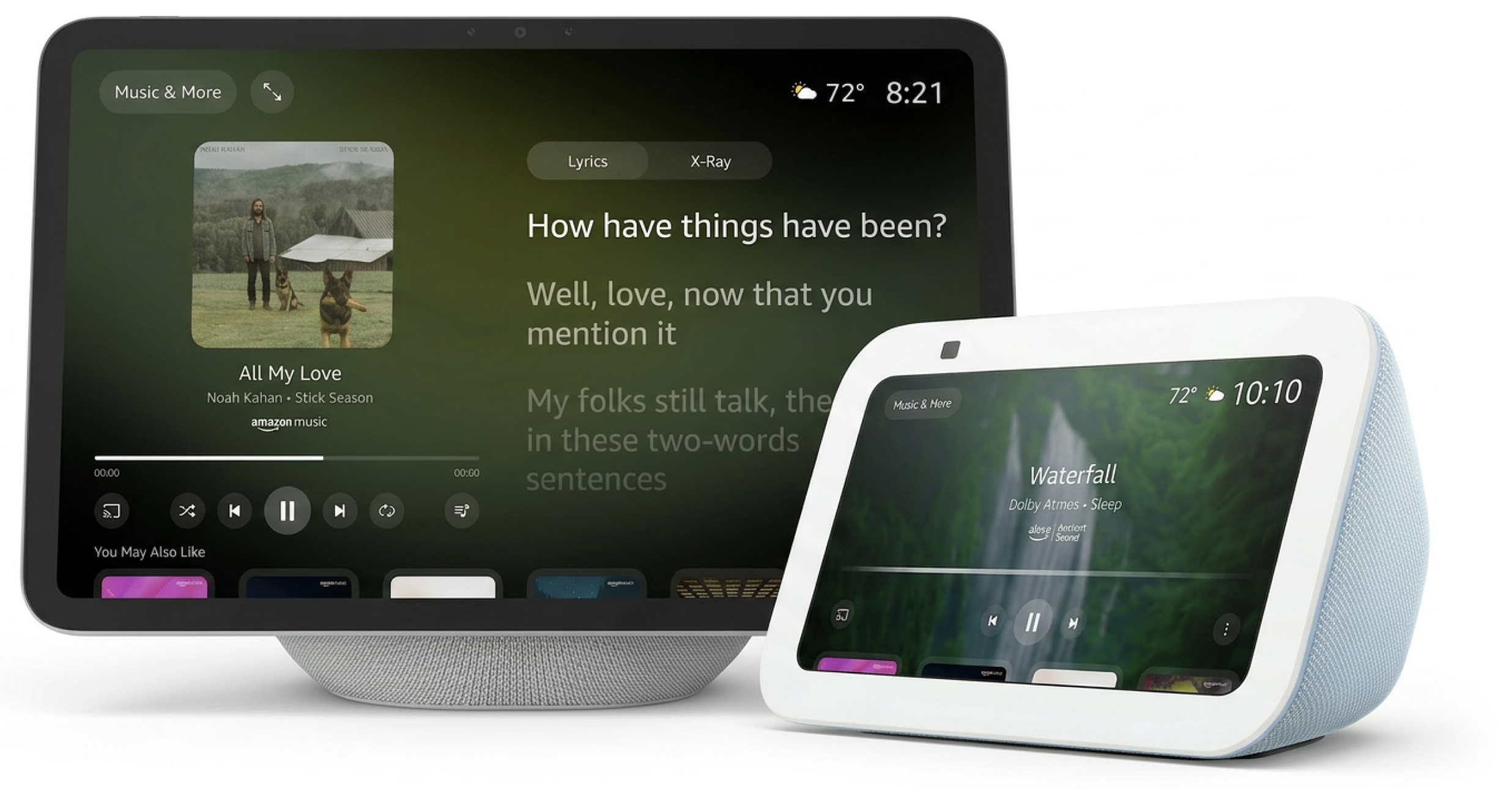 Two smart speakers with screens displaying music players and lyrics, one in gray and the other in white with blue accents, set against a white background.