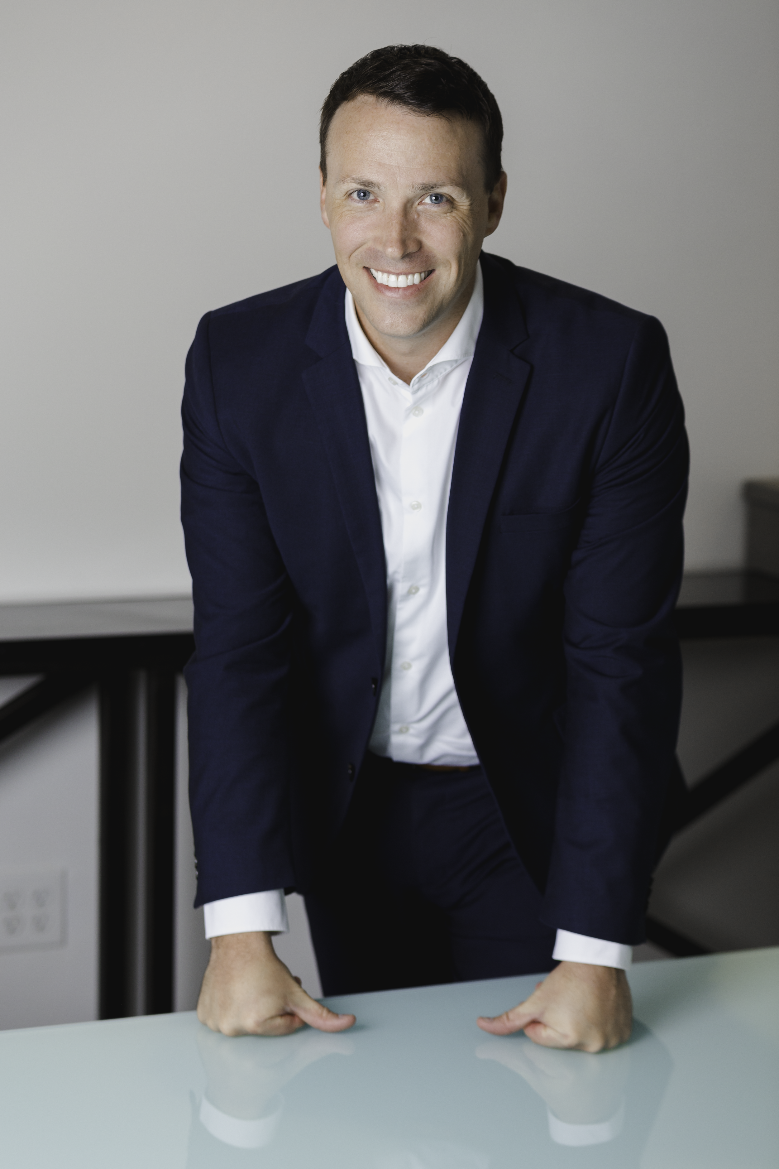 Chris_Leaning on Table.png