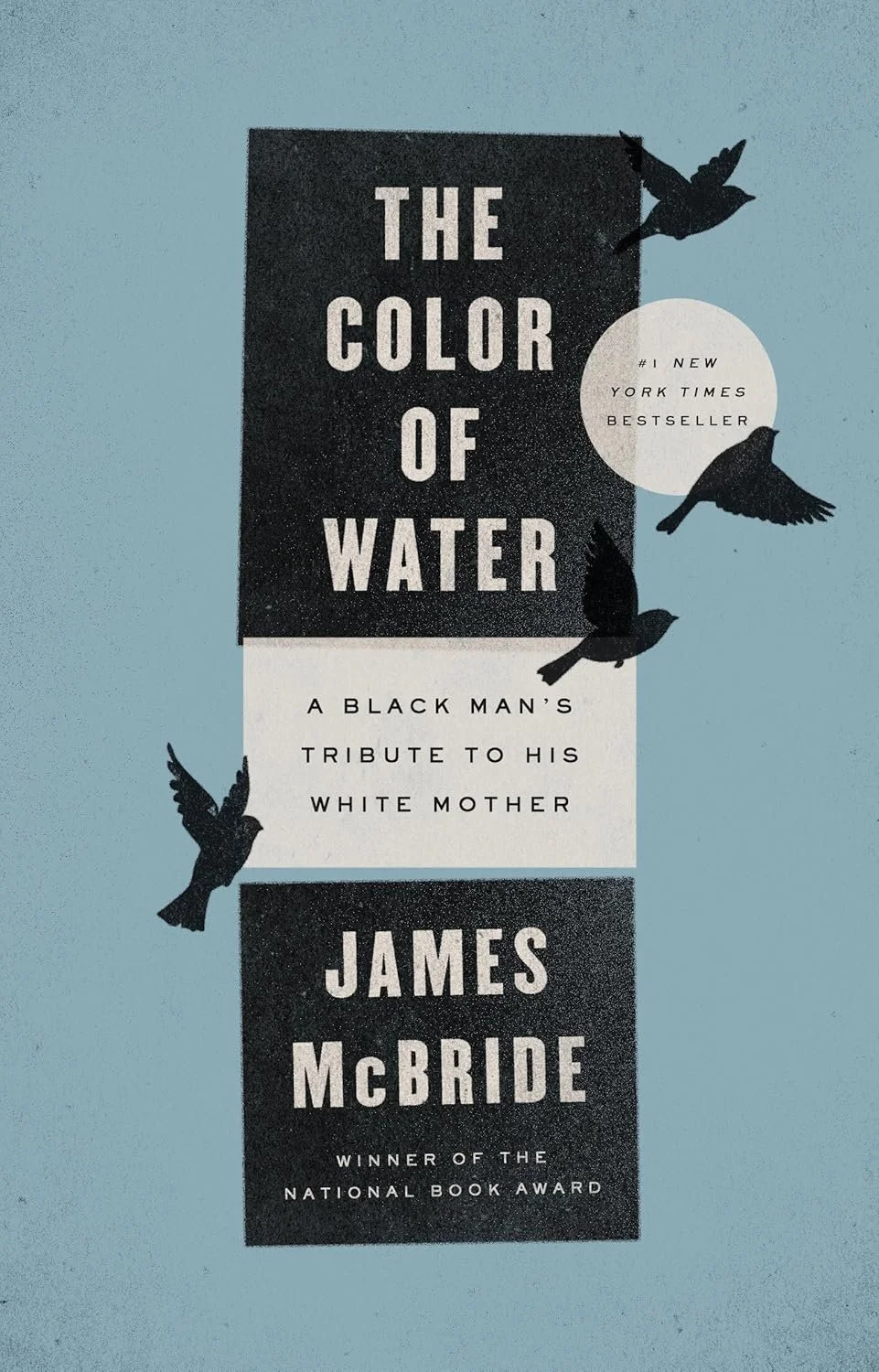 Book cover for "The Color of Water" by James McBride, featuring black bird silhouettes on a blue background with black and white text, and a white circle with additional text.