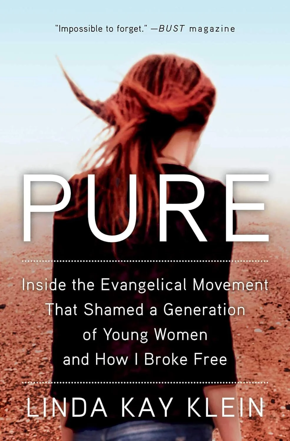 Book cover titled "PURE" with a woman with red hair standing in a field, facing away, under a cloudy sky, with the quote "Impossible to forget." from BUST magazine.
