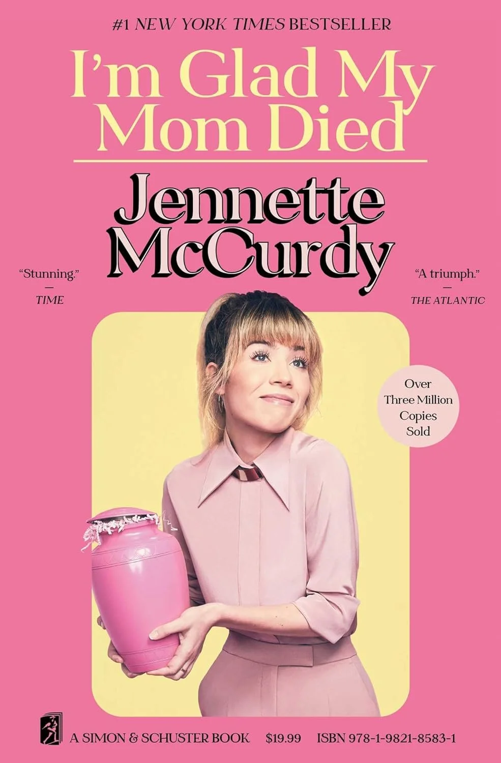 Book cover of 'I'm Glad My Mom Died' by Jennette McCurdy, featuring a woman in a pink outfit holding a pink urn, with pink and yellow background and text.