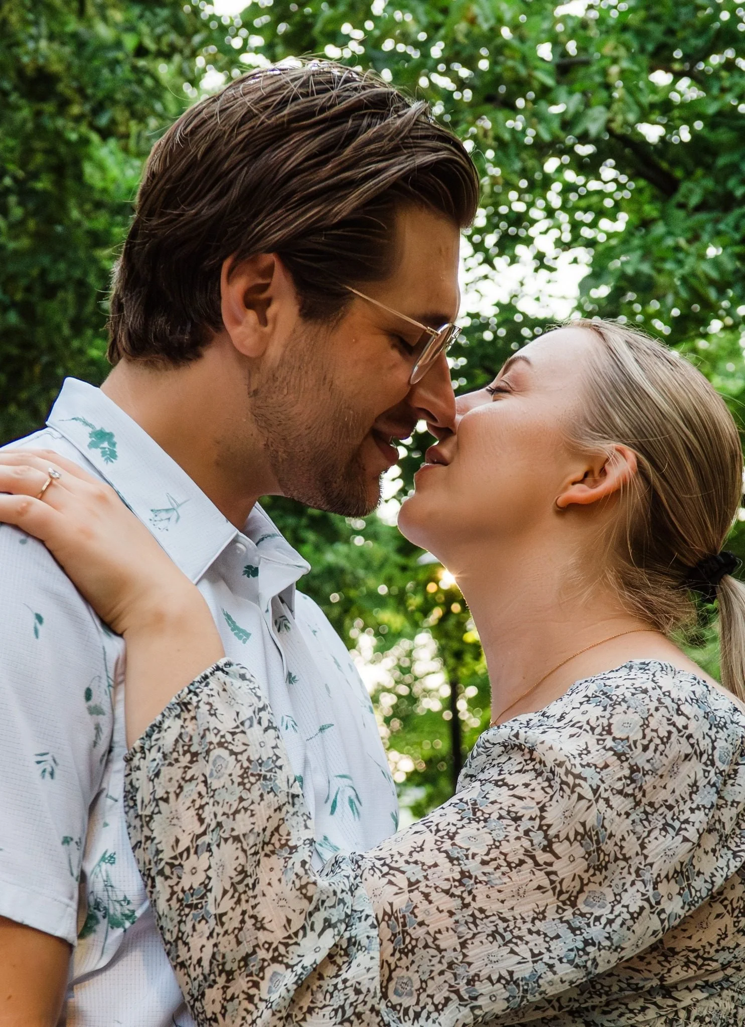 Couple sharing a close-up portrait moment in downtown Medicine Hat during an Alberta couples photography session by Kevin M Films.
