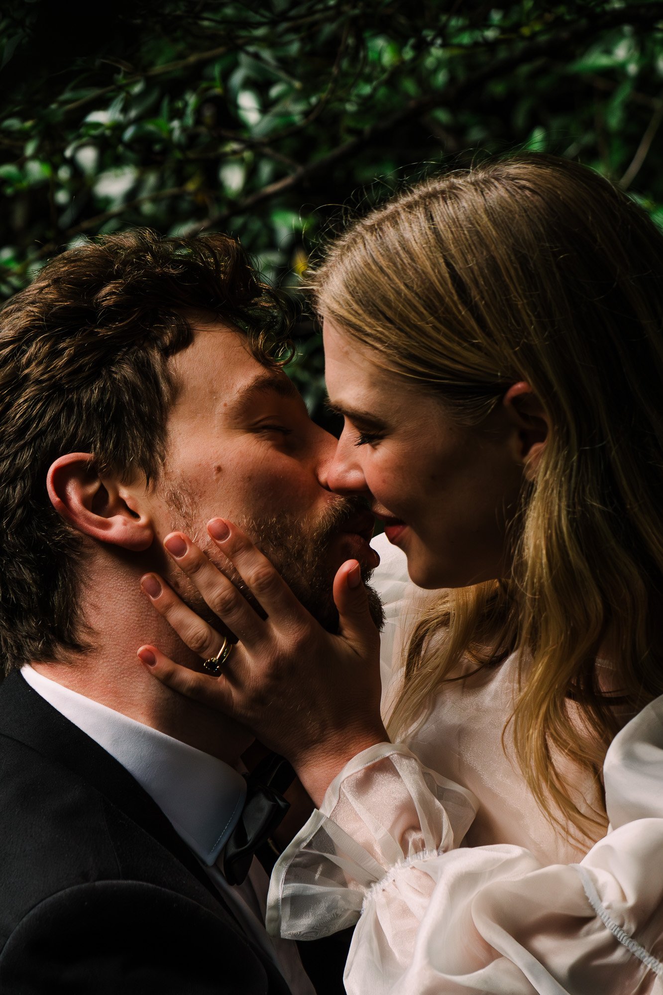 Close portrait of a styled elopement couple near Tawhai Falls during a New Zealand elopement photography session by Kevin M Films.