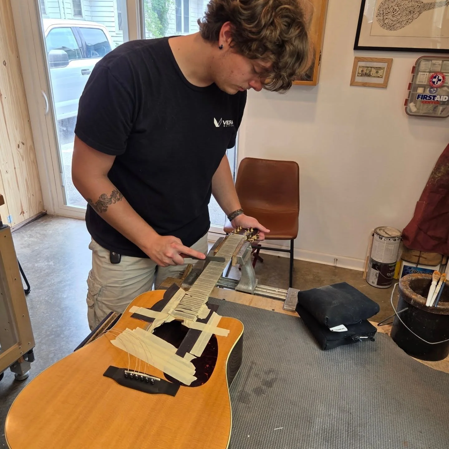 a student learns about the art of guitar setups at heritage luthier school in lexington north carolina with luthier john vergara
