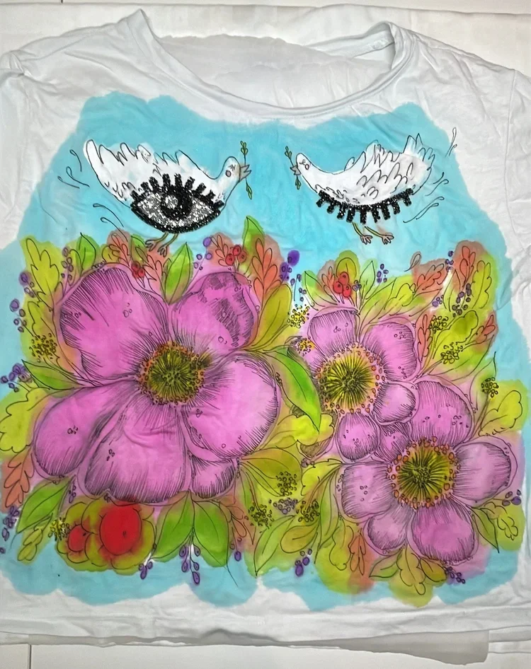 Hand painting preloved and vintage clothes