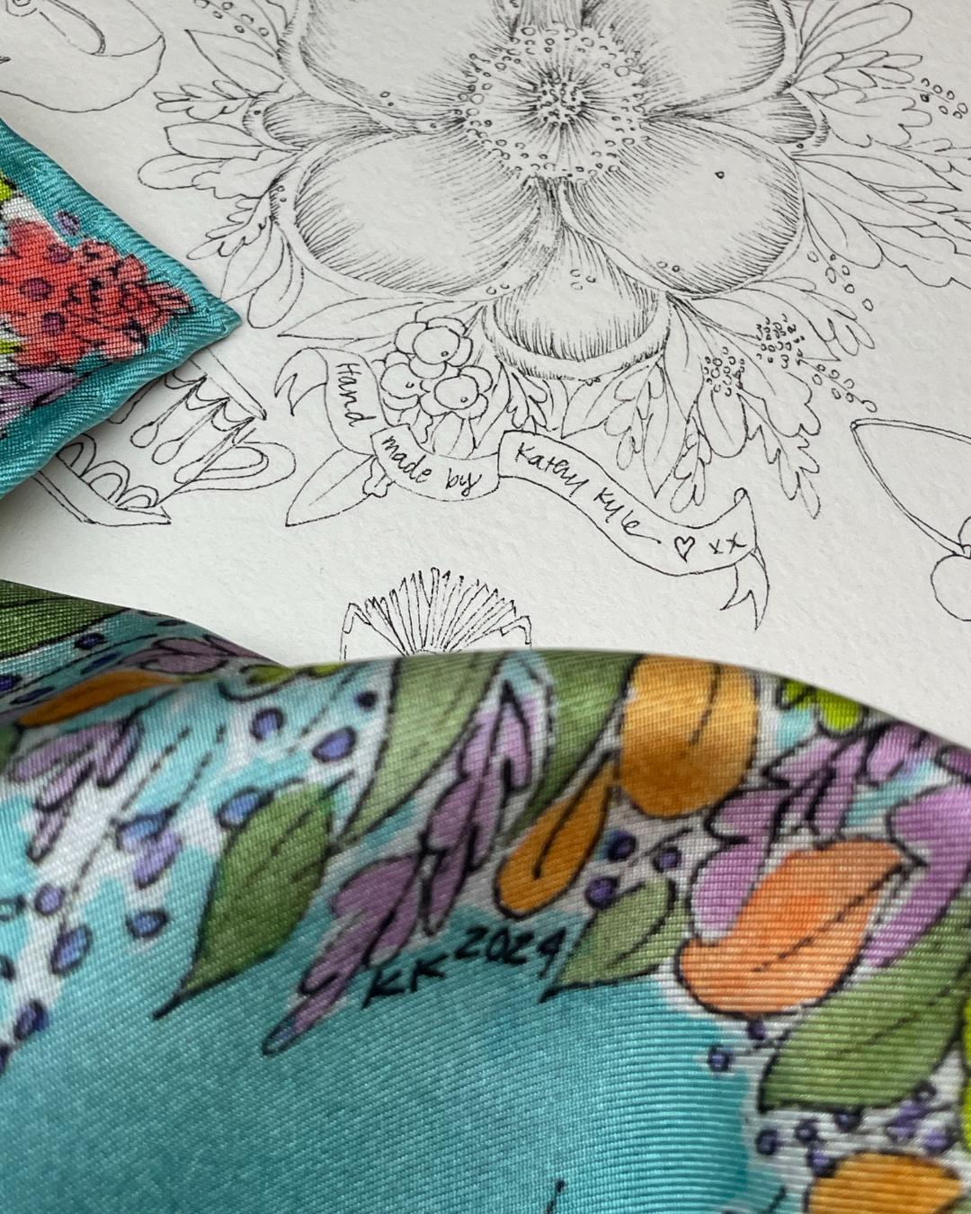 Kathy Kyle begins every piece with a line drawing and then hand paints the artwork on arches paper. This is then printed sustainably on to 100% silk.