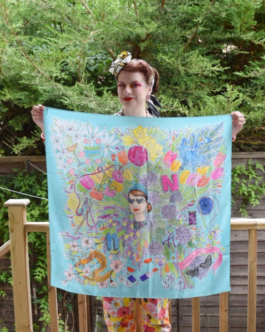 Anna holding her one of a kind bespoke scarf custom designed for her.