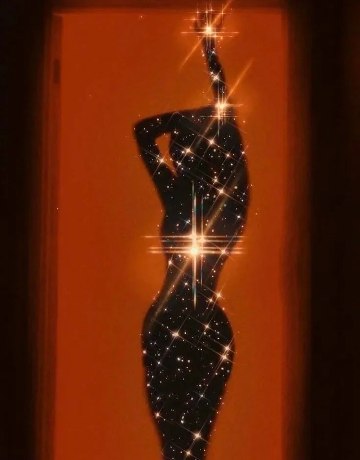 Silhouette of a woman striking a pose, with a sparkling, star-like effect overlayed on her body against an orange background.