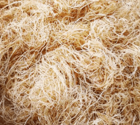 Close-up of shredded or fibrous natural material, possibly nest or insulation.