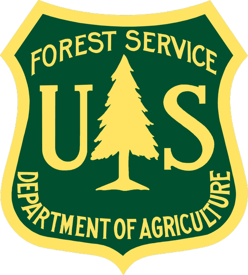 U.S. Forest Service badge with a green background and yellow border, featuring a yellow pine tree in the center, and text indicating it's part of the Department of Agriculture.
