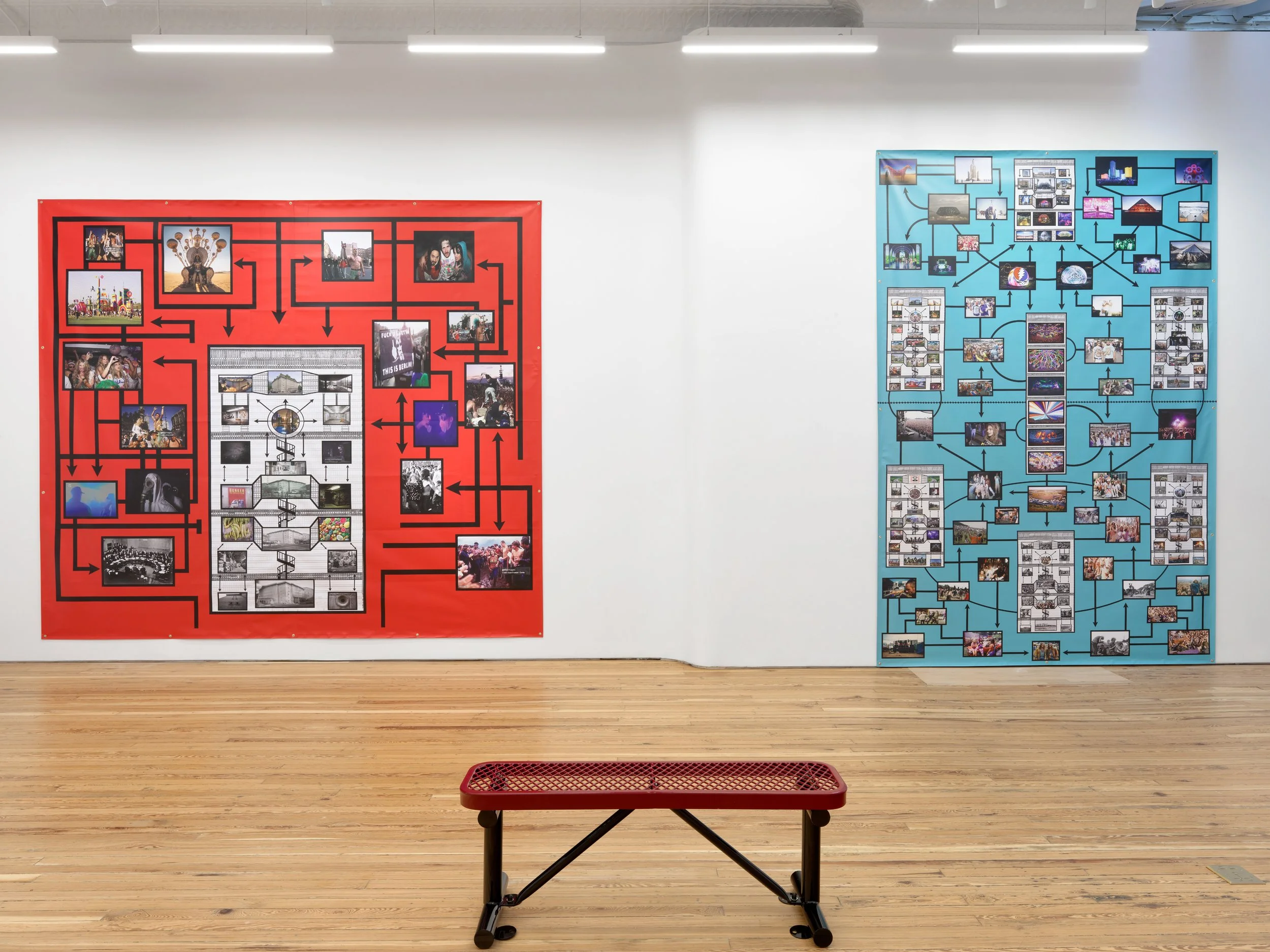 A white gallery room with a small red bench features two large 2D works on its walls. Both featre collages of various images connected by overlapping black arrows. One piece has a red background, while the other has a cyan background.