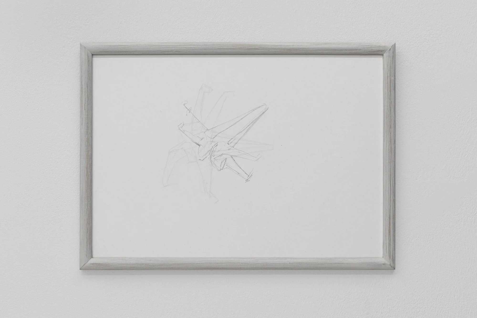 A minimalist pencil drawing of abstract, intersecting geometric lines, framed in light wood and hung on a white wall.