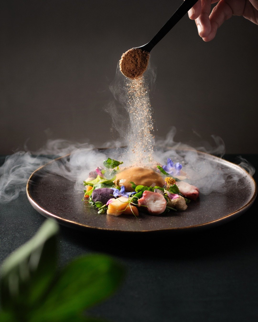 A Treasure Trove of Sugar, Spice, and Everything Nice

Inspired by the classic &ldquo;cuttlefish and kangkong,&rdquo; this reimagined dish pairs grilled octopus with caramelised shrimp paste snow, macadamia, local flowers, and a delicate green mango 