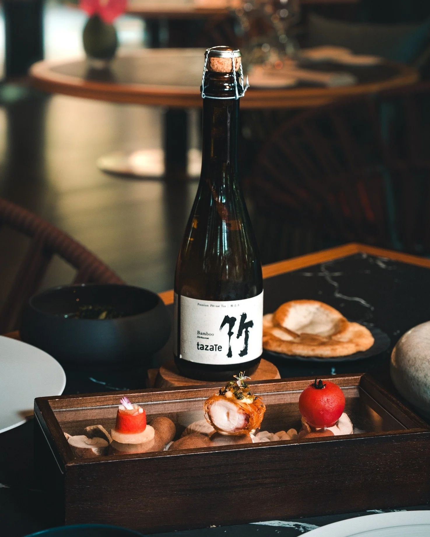 Curated sparkling teas meet Quenino&rsquo;s bold Southeast Asian flavours in pairings that cut through richness, lift the palate, and reveal something unexpected.

With This with That, bright pours and thoughtful plates come together in a way that fe