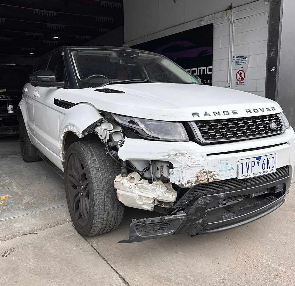 Car smash damage on white Range Rover
