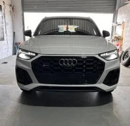 Car accident repair on white Audi by Phantom Autobody