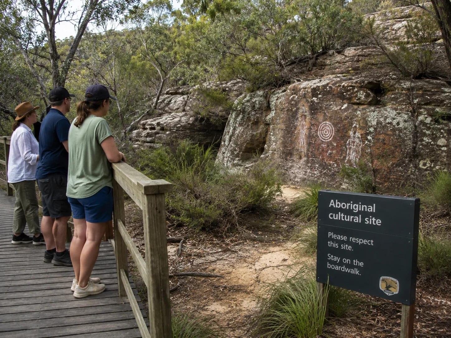 Visitors staying on a boardwalk near an Aboriginal site