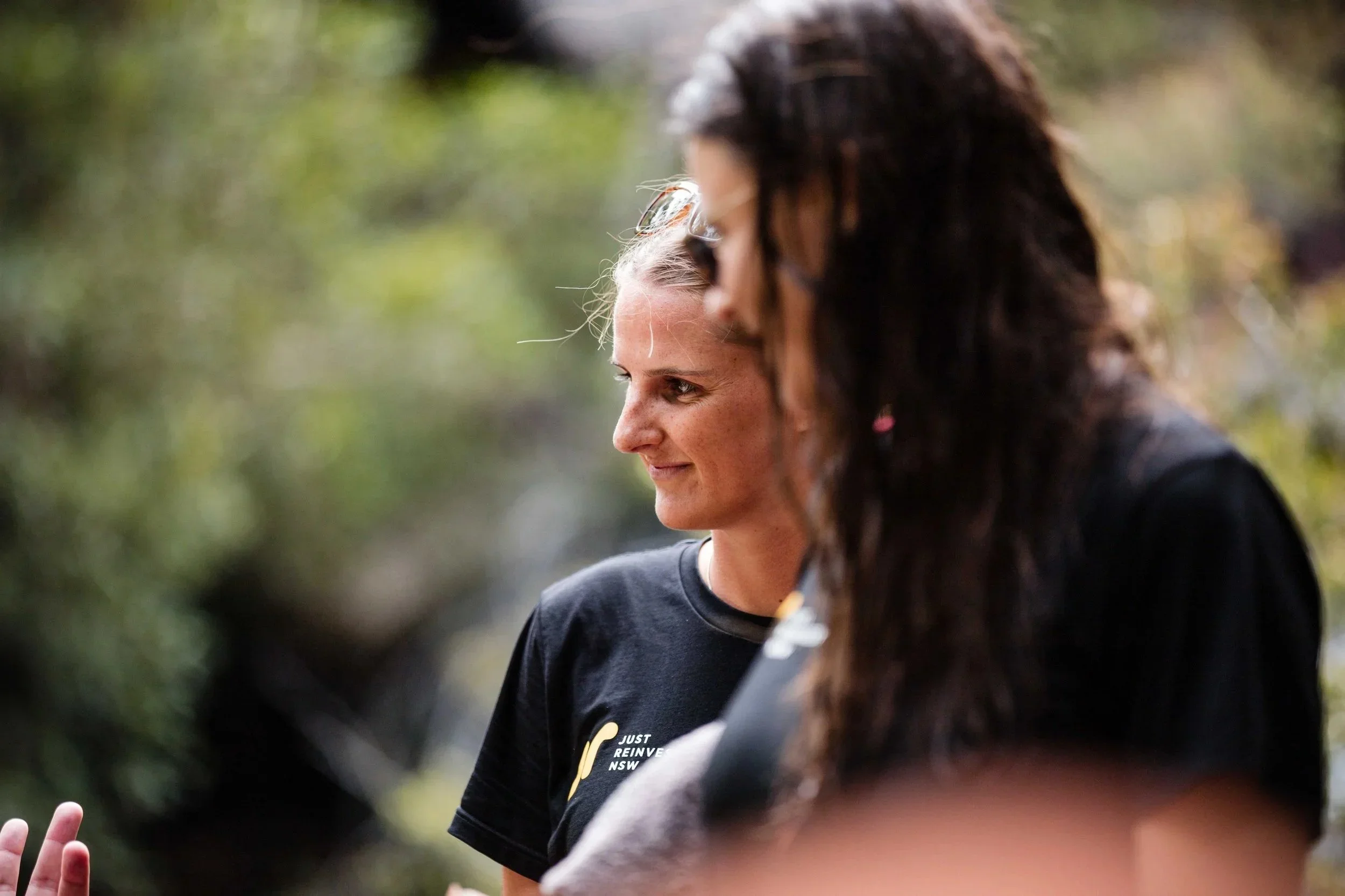 Team members listening during an Indigenous cultural team building experience in Sydney