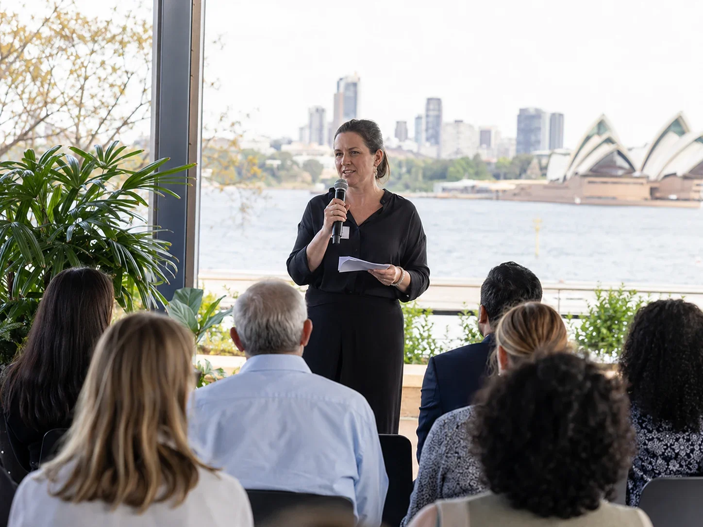 Speaker giving an Acknowledgement of Country at a Sydney event.
