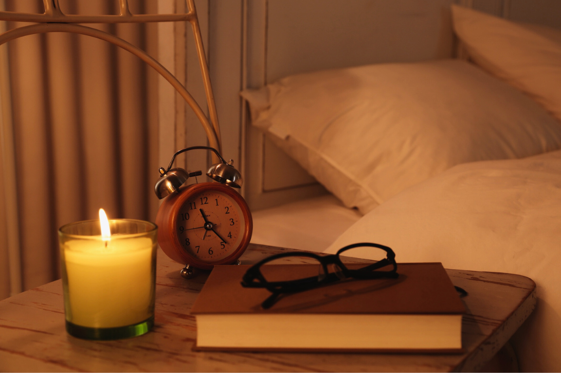 Evening routine with candlelight and no screens, supporting melatonin and mitochondrial repair at night
