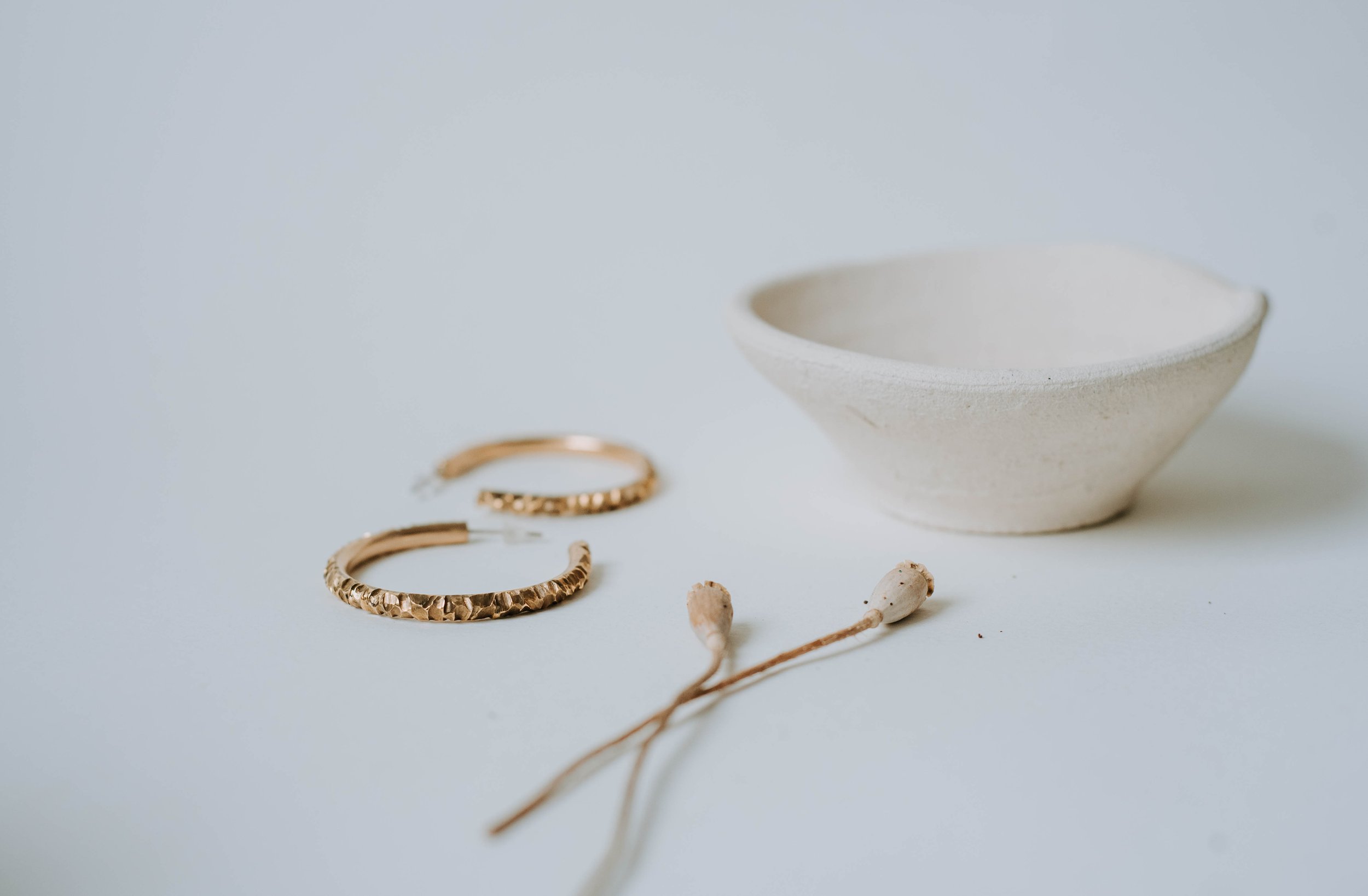 Sculpted hoops with an abstract texture. It's elegant and minimalistic.