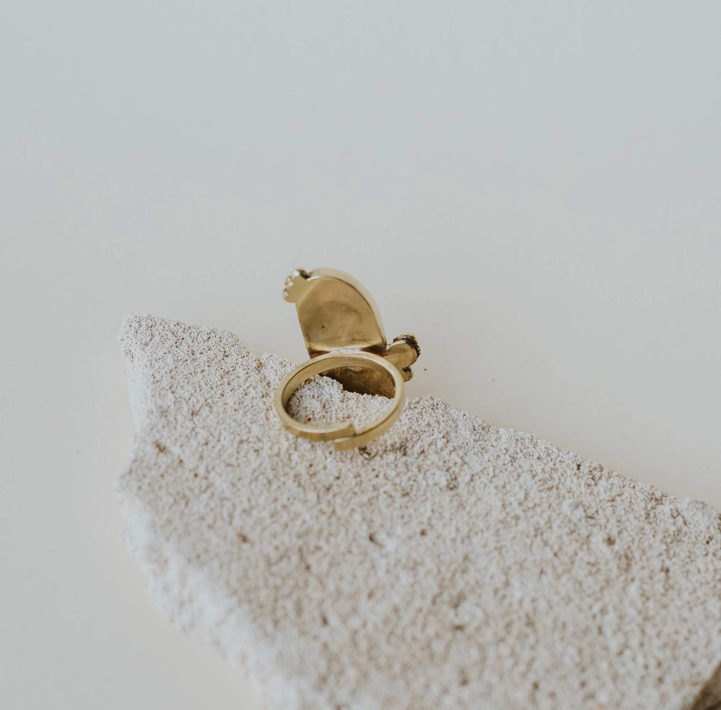 Back view of black pebble ring showing adjustable band.