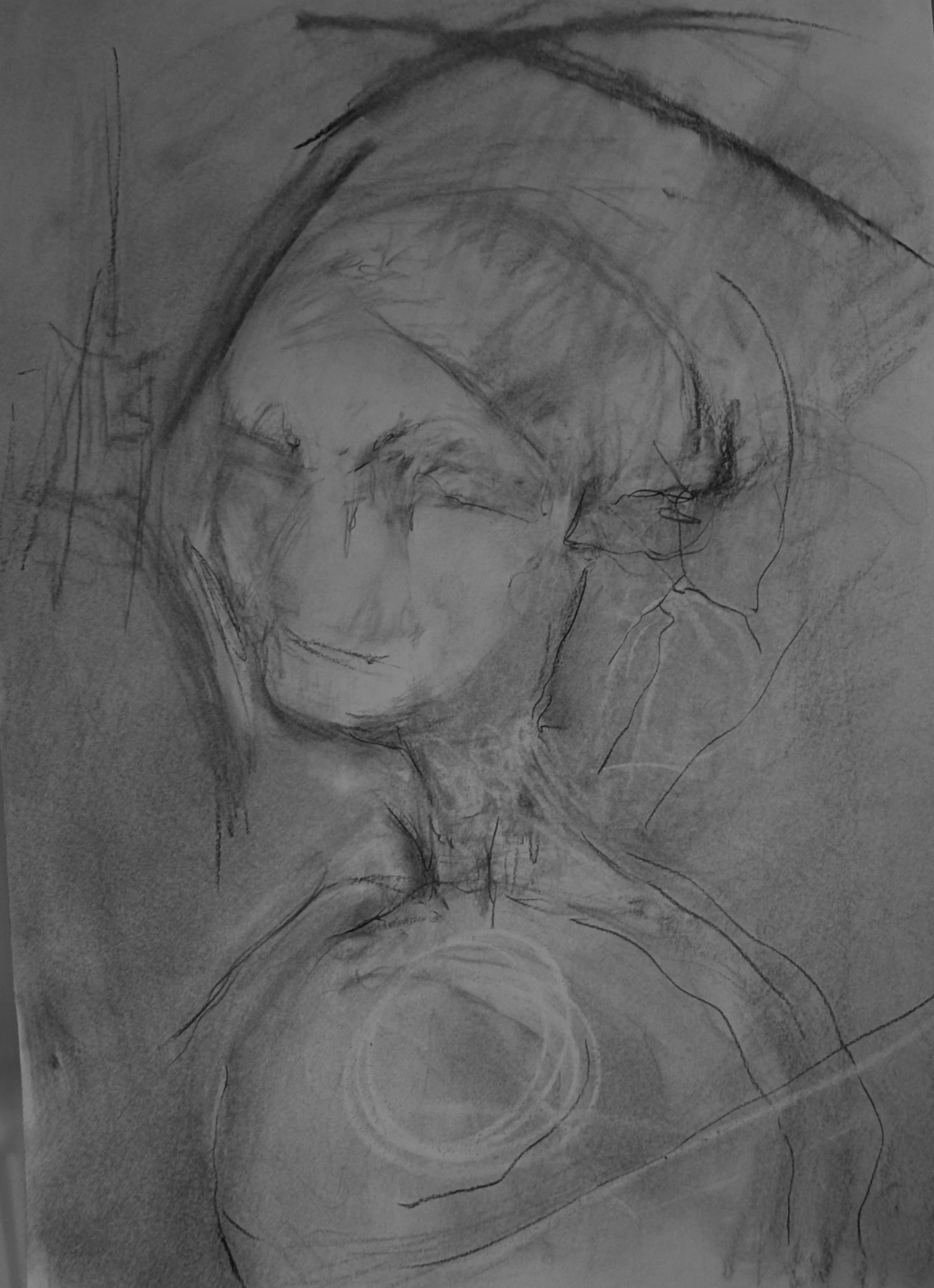 A rough, monochrome sketch of a person's face resting on a surface, with a circular object nearby.
