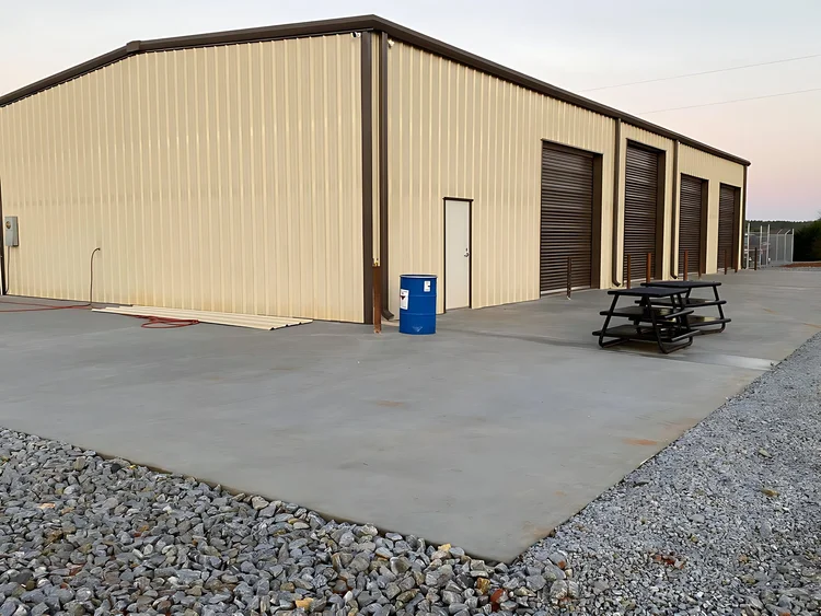 Tan four-bay steel shop