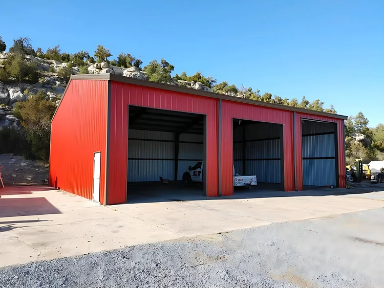 Red three-bay open equipment barn