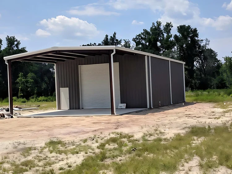 Gray steel garage with an open lean-to carport